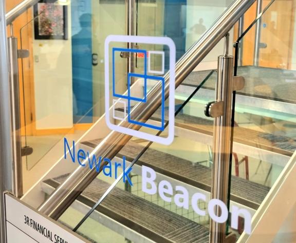 The Newark Beacon logo on a glass background