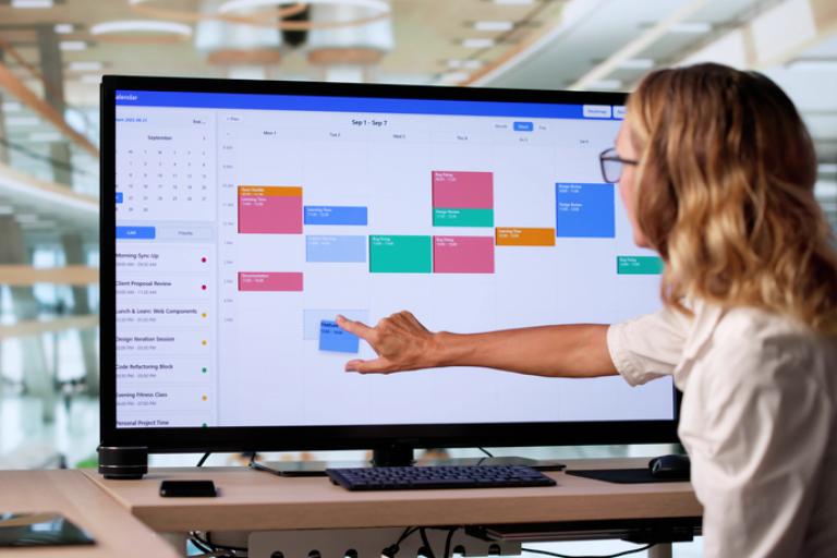 A person re-arranging meetings in their calendar