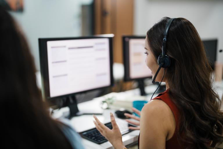 Customer services staff working on computers
