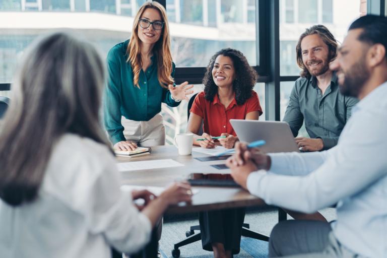 A group of people in a meeting room